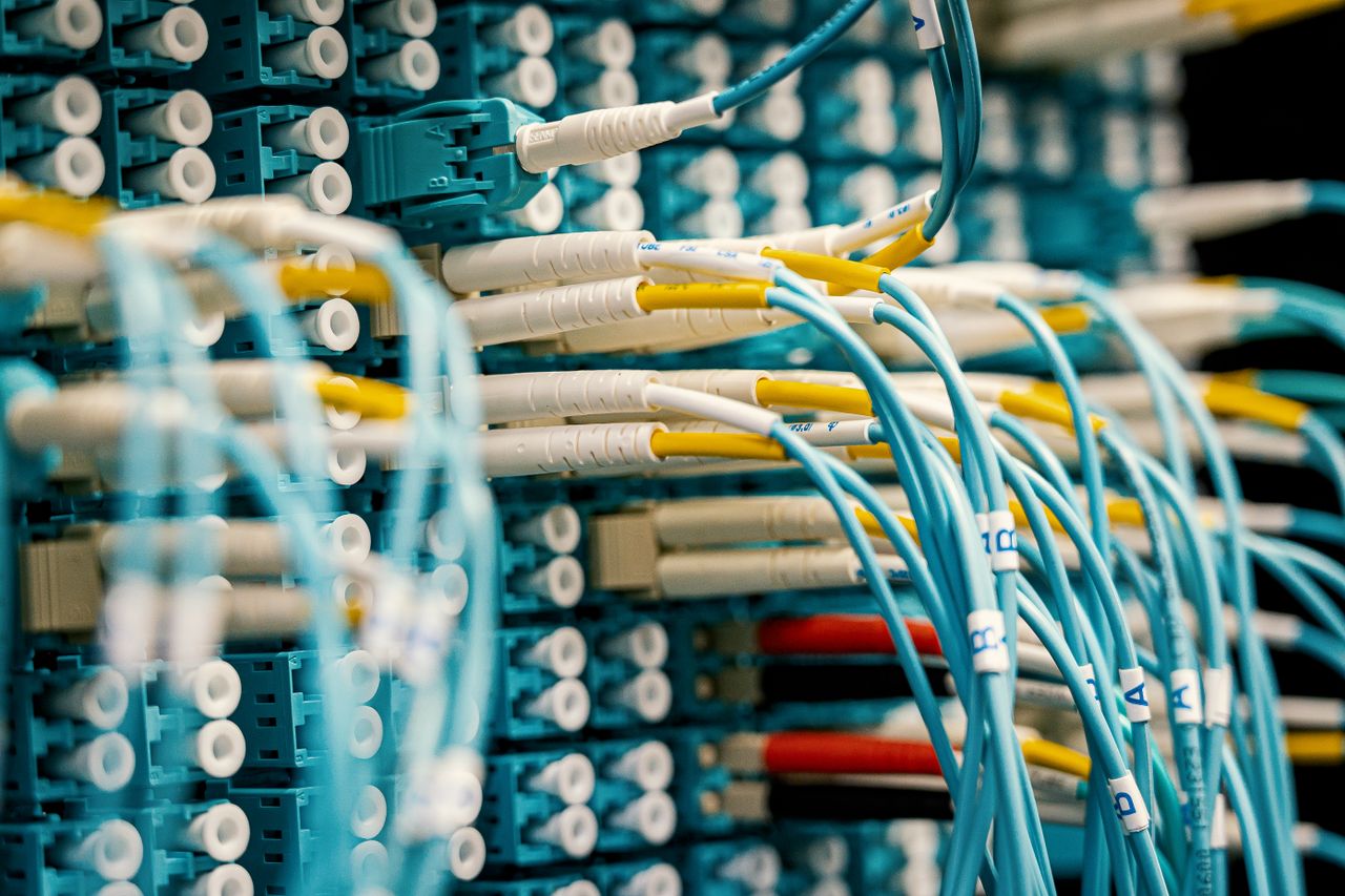The Art of Drawing Readers In: Your attractive post title goes here Industrial optical switch with connected rubber cables of different colors with stickers representing letters and numbers and plastic terminations