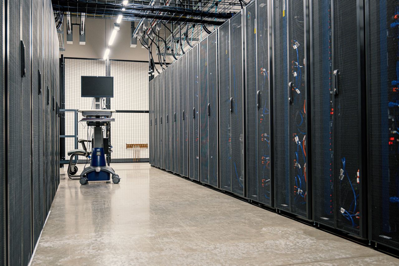 About Steel framework cabinets housing servers networking devices and cables in contemporary equipped data center